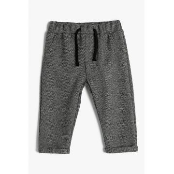 Pantaloni conici cu talie elastica