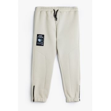 Pantaloni de trening cu slituri cu fermoar